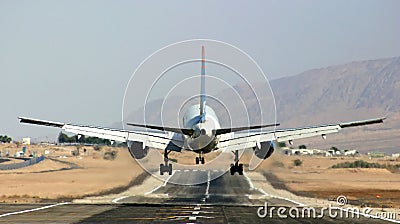 Passenger airplane landing on runway. Stock Photo