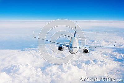 Passenger airplane performing flight flies in the sky Stock Photo