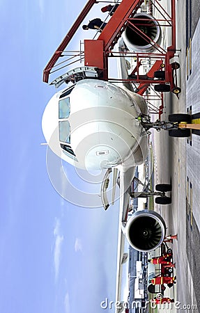 Passenger boarding airplane from front view Editorial Stock Photo