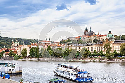 Passenger boat on the cityscape Prague background. Stock Photo