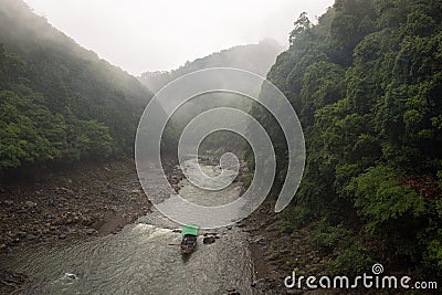 Passenger boat navigating down the Katsura River Stock Photo