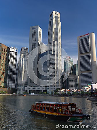 View of Singapore River with boat in front Editorial Stock Photo