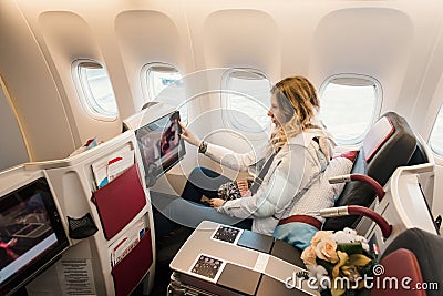 Passenger in business class of airplane Stock Photo