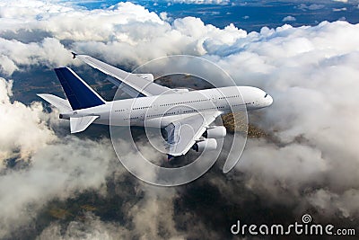 Passenger double decker plane in flight. Aircraft fly high above the clouds Stock Photo