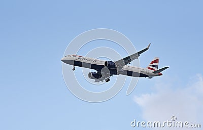 Passenger jet aircraft with undercarriage lowered. Editorial Stock Photo