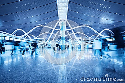 Passenger movement blur in busy airport terminal Editorial Stock Photo