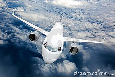 Passenger plane in flight. Aircraft fly high in the sky. Front view. Right heeling Stock Photo