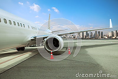 passenger plane parking in airport runway with urban scene background Stock Photo