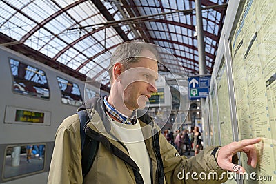 Passenger at timetable Stock Photo