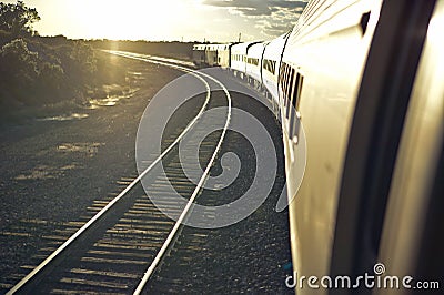 Passenger train traveling into the Arizona sunset Editorial Stock Photo