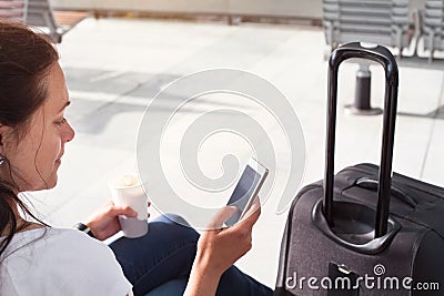 Passenger using mobile internet or wifi in airport Stock Photo