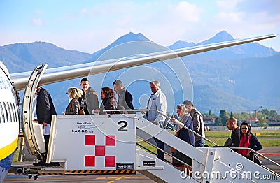 Passengers boarding the plane at Orio Al Serio airport in Bergamo Editorial Stock Photo