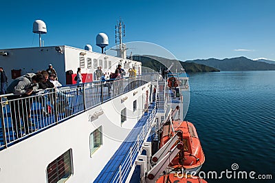 Passengers on ferry traveling from Wellington to Picton via Marlborough Sounds, New Zealand Editorial Stock Photo
