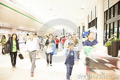 Passengers in a hurry to walk in passenger terminal of airport, Editorial Stock Photo