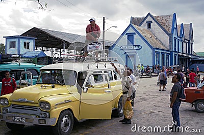 Passengers loading a collectible taxi in Cuba Editorial Stock Photo