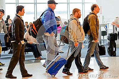 Passengers queued in line for boarding at departure gate Editorial Stock Photo