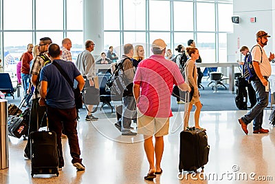 Passengers queued in line for boarding at departure gate Editorial Stock Photo