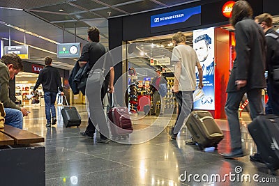 Passengers on their way to flight l at an airport Editorial Stock Photo