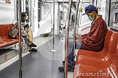 Passengers traveling by suburban electric train Red Line to Rangsit Station Pathum Thani, Thailand Editorial Stock Photo