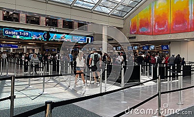 Passengers on TSA Security Checkpoint line at Orlando International Airport in Florida, USA Editorial Stock Photo