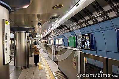 passengers wait for train at Osaka subway Editorial Stock Photo