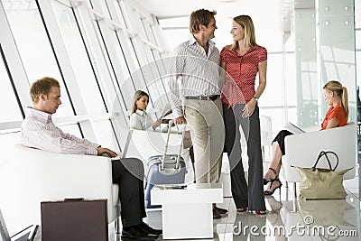 Passengers waiting in airport departure lounge Stock Photo