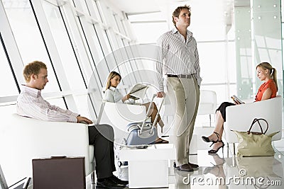 Passengers waiting in airport departure lounge Stock Photo