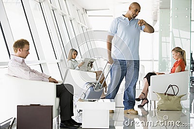 Passengers waiting in airport departure lounge Stock Photo