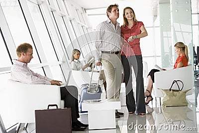 Passengers waiting in airport departure lounge Stock Photo