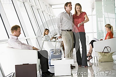 Passengers waiting in airport departure lounge Stock Photo