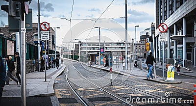 Passengers waiting for an electric tram in Dublin, Ireland Editorial Stock Photo