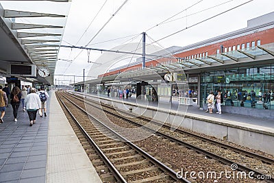 Passengers waiting for the train to came Stock Photo