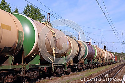 Passing train from railway tanks and empty rails Stock Photo