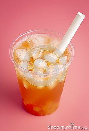 Passion Fruit Boba Tea on a Pink Background Stock Photo