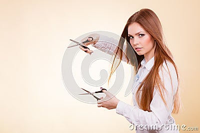 Passionate female hairdresser. Stock Photo