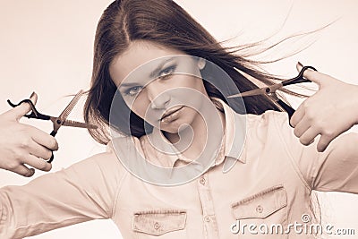 Passionate female hairdresser. Stock Photo