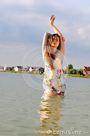 Passionate girl in a nightgown in the lake Stock Photo