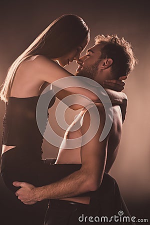 passionate lovers hugging and looking at each other, Stock Photo