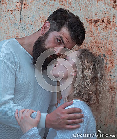 Passionate man gently kissing beautiful woman with desire. Love story or portrait couple in love. Affectionate couple Stock Photo