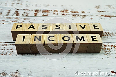 Passive Income Word alphabet letters on wooden background Stock Photo