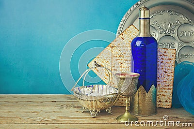 Passover background with matzo and wine on wooden vintage table. Seder plate with hebrew text Stock Photo