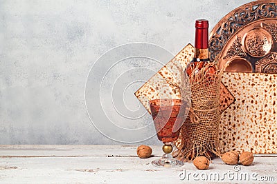 Passover holiday concept with wine and matzoh over rustic background Stock Photo