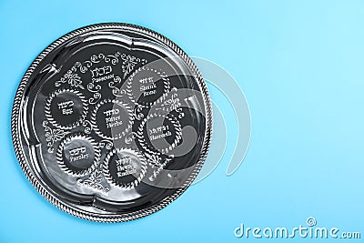 Passover Seder plate keara on blue background, top view with space for text. Pesah celebration Stock Photo