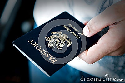 Passport in hand Stock Photo