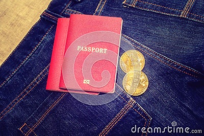 Passport in jeans and bitcoins, the concept of modern puies Stock Photo