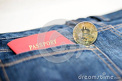 Passport in jeans and bitcoins, the concept of modern puies Stock Photo