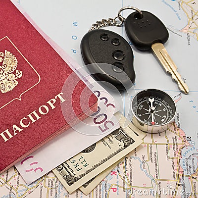 Passport with the money , Car key and compass Stock Photo