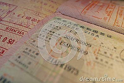 Passport page with Chinese visa and immigration control stamps. Stock Photo