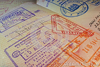 Passport page with Malaysian visa and immigration control stamps. Stock Photo