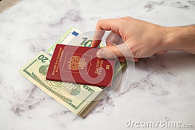 Passport of the Russian Federation and euro and dollar banknotes. Editorial Stock Photo